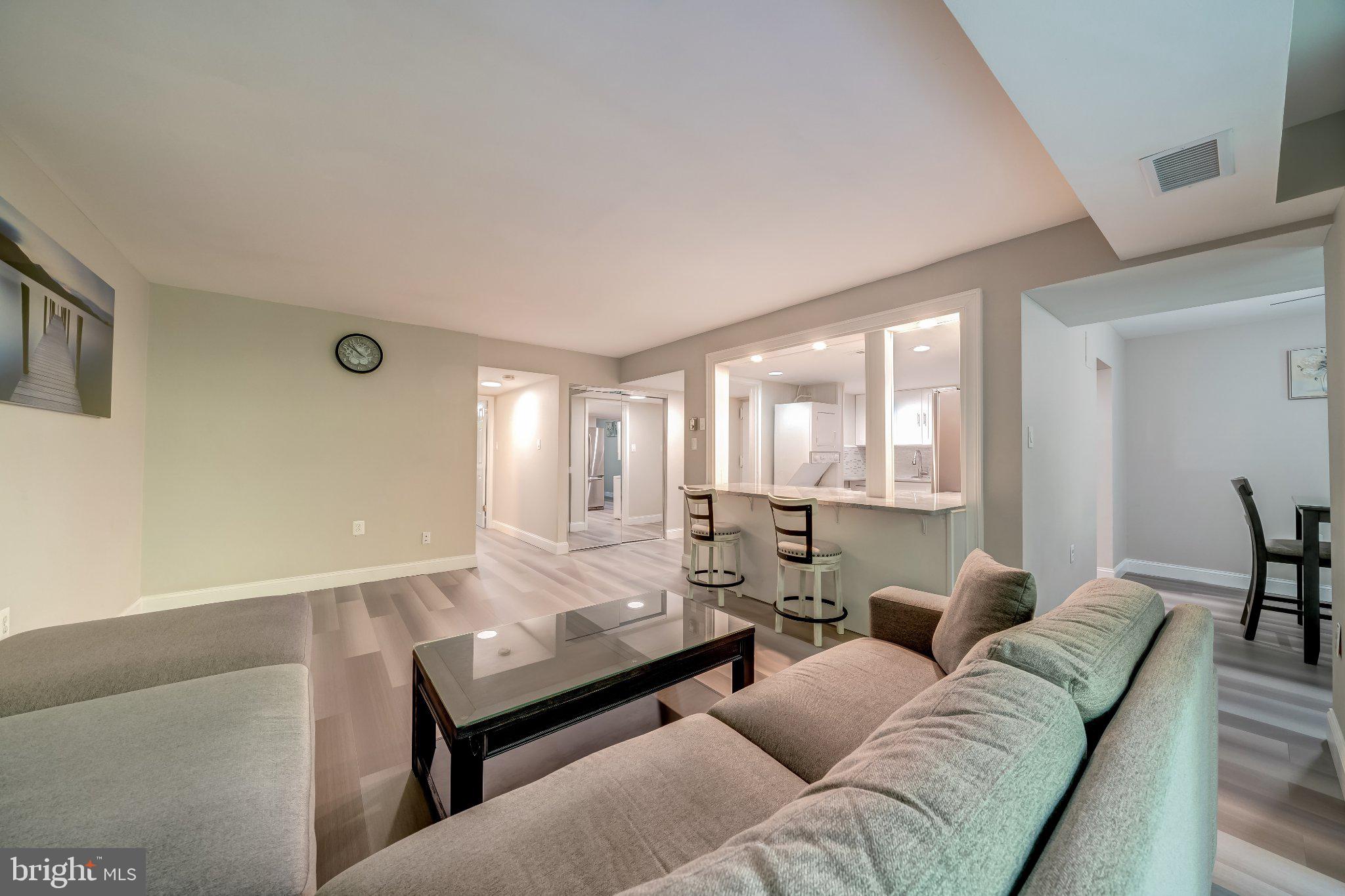 1429 Northgate Square, Unit 2A Reston, VA 20190 - Photo 7 of 25 a living room with furniture and a large window