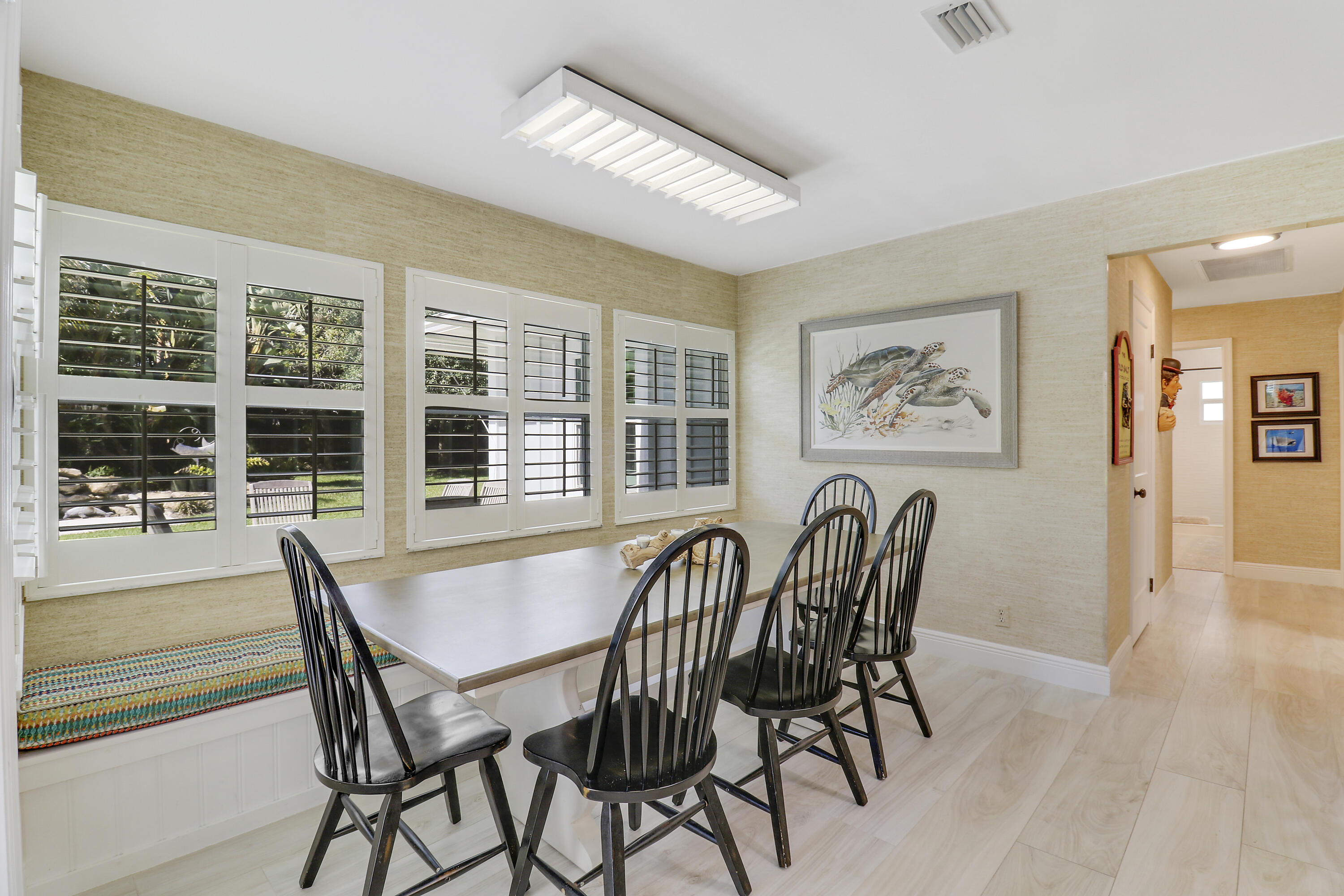 6372 North 197th Place Jupiter, FL 33458 - Photo 19 of 77 a patio with table and chairs