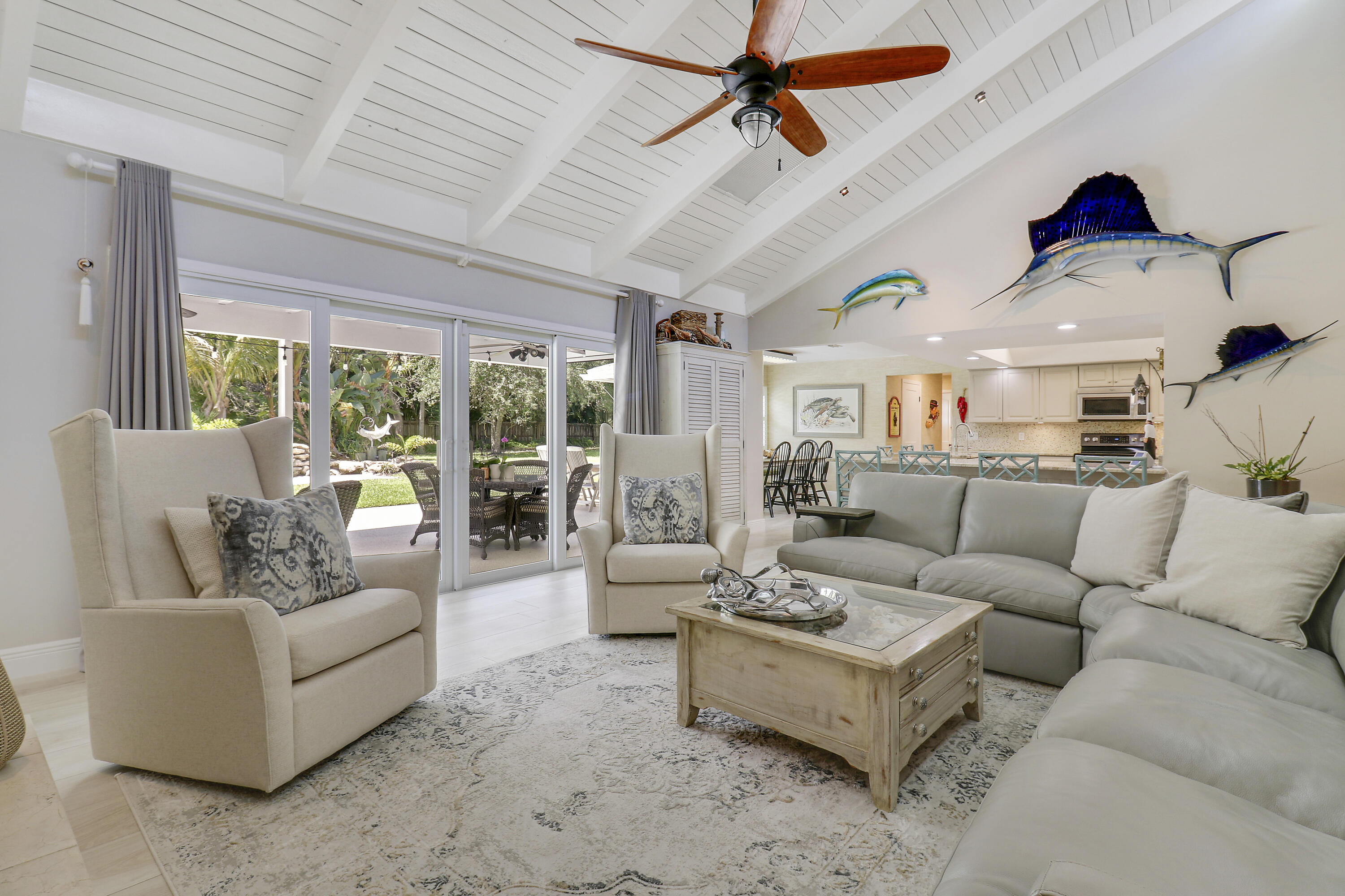 6372 North 197th Place Jupiter, FL 33458 - Photo 25 of 77 a living room with furniture ceiling fan and a large window
