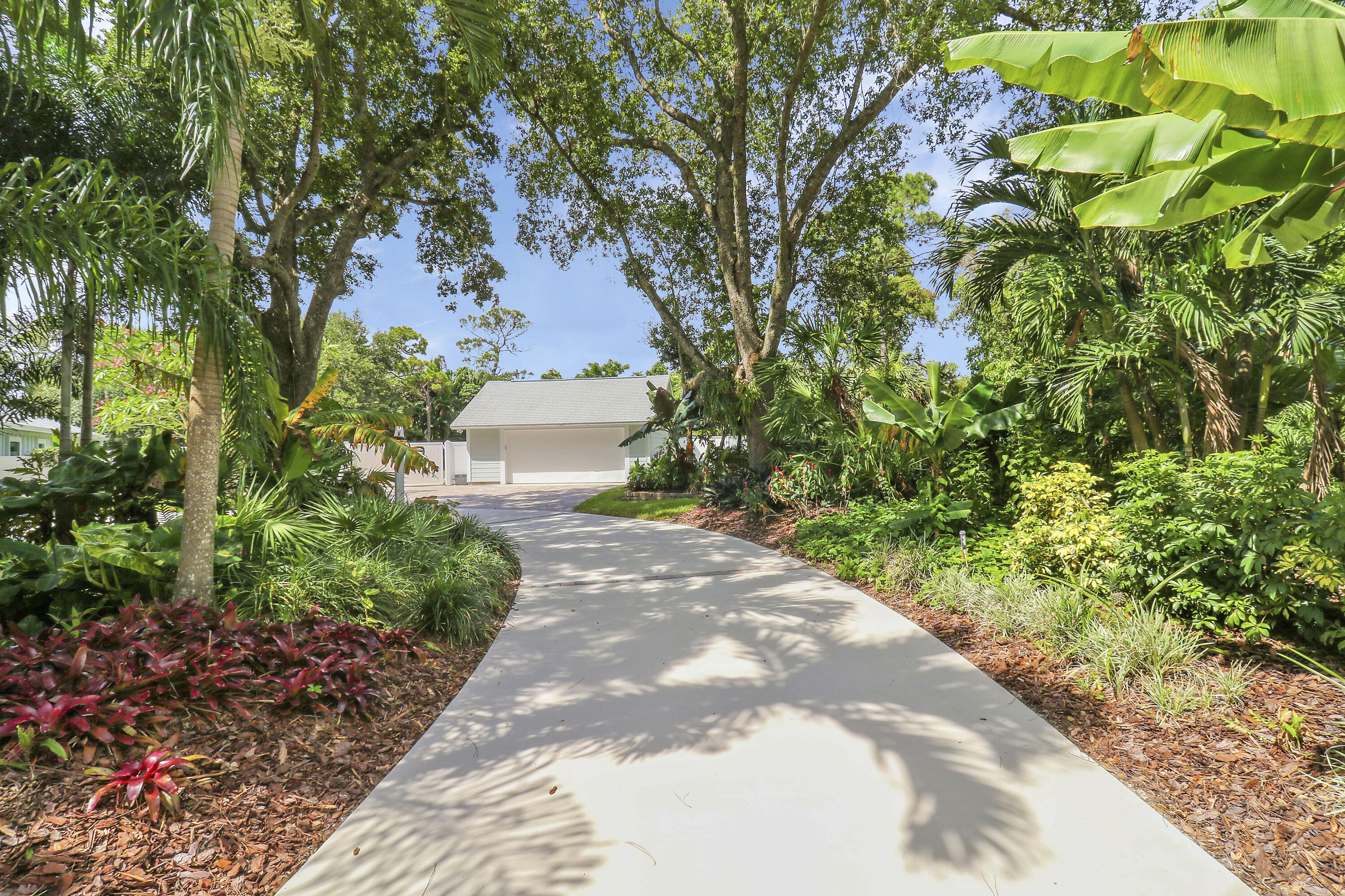6372 North 197th Place Jupiter, FL 33458 - Photo 26 of 77 a view of a pathway with a yard
