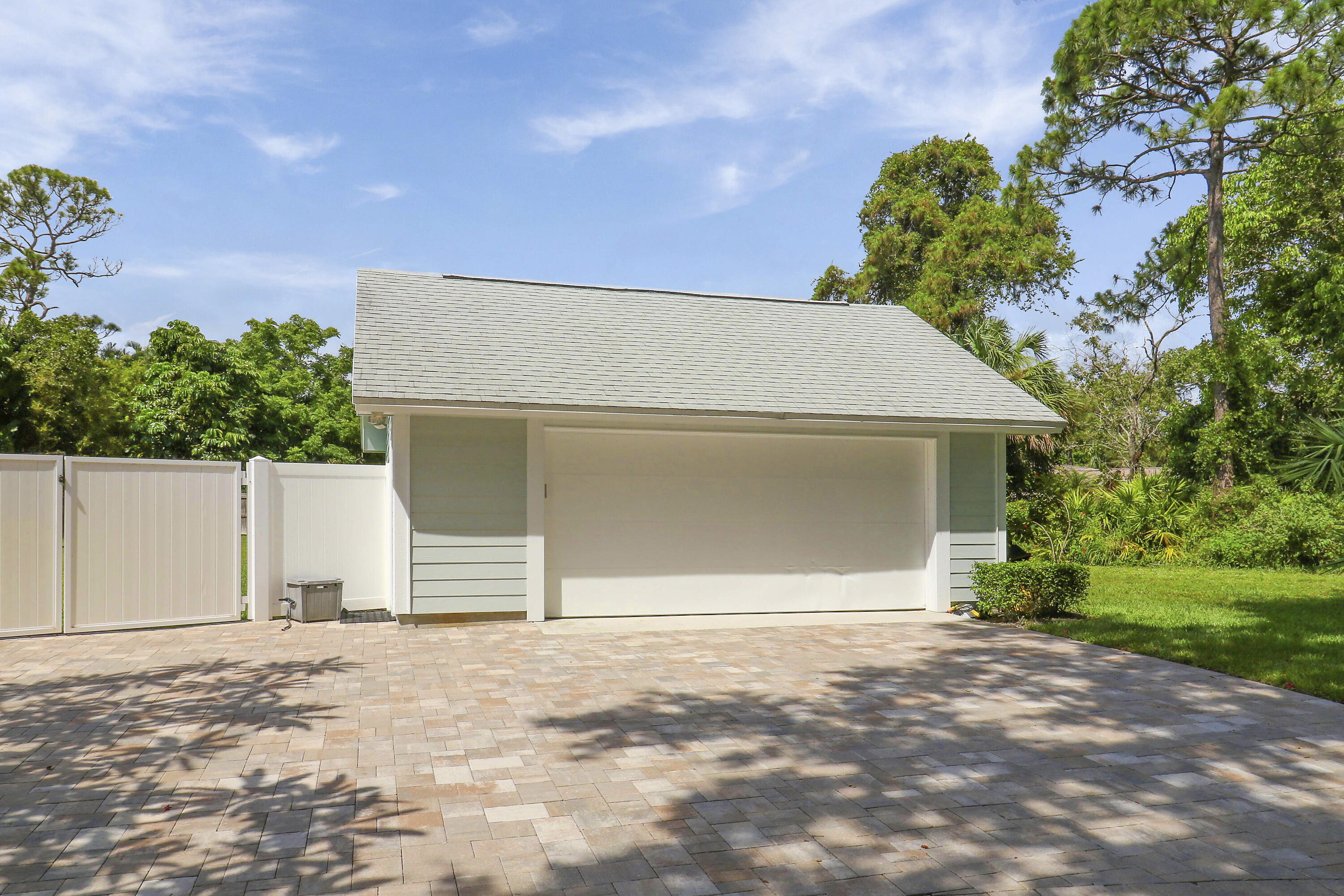 6372 North 197th Place Jupiter, FL 33458 - Photo 29 of 77 a front view of a house with a yard and garage