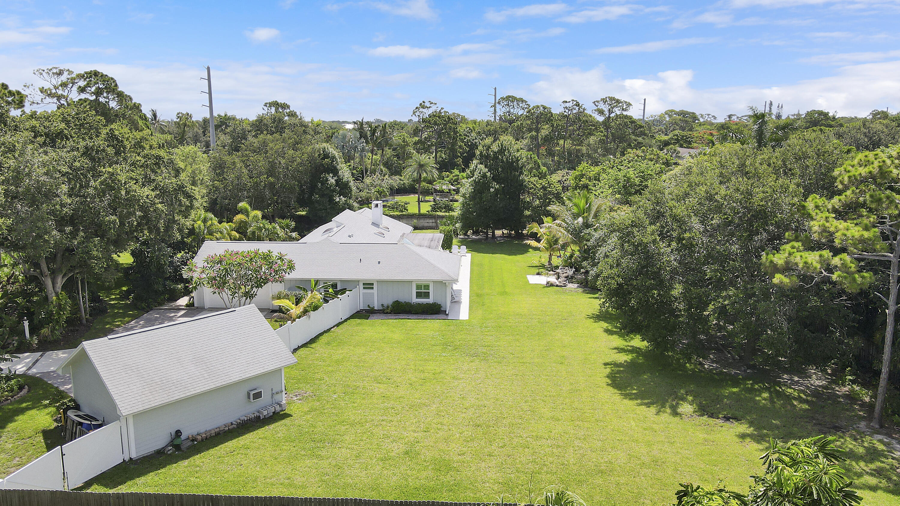 6372 North 197th Place Jupiter, FL 33458 - Photo 3 of 77 an aerial view of a house with yard swimming pool and outdoor seating