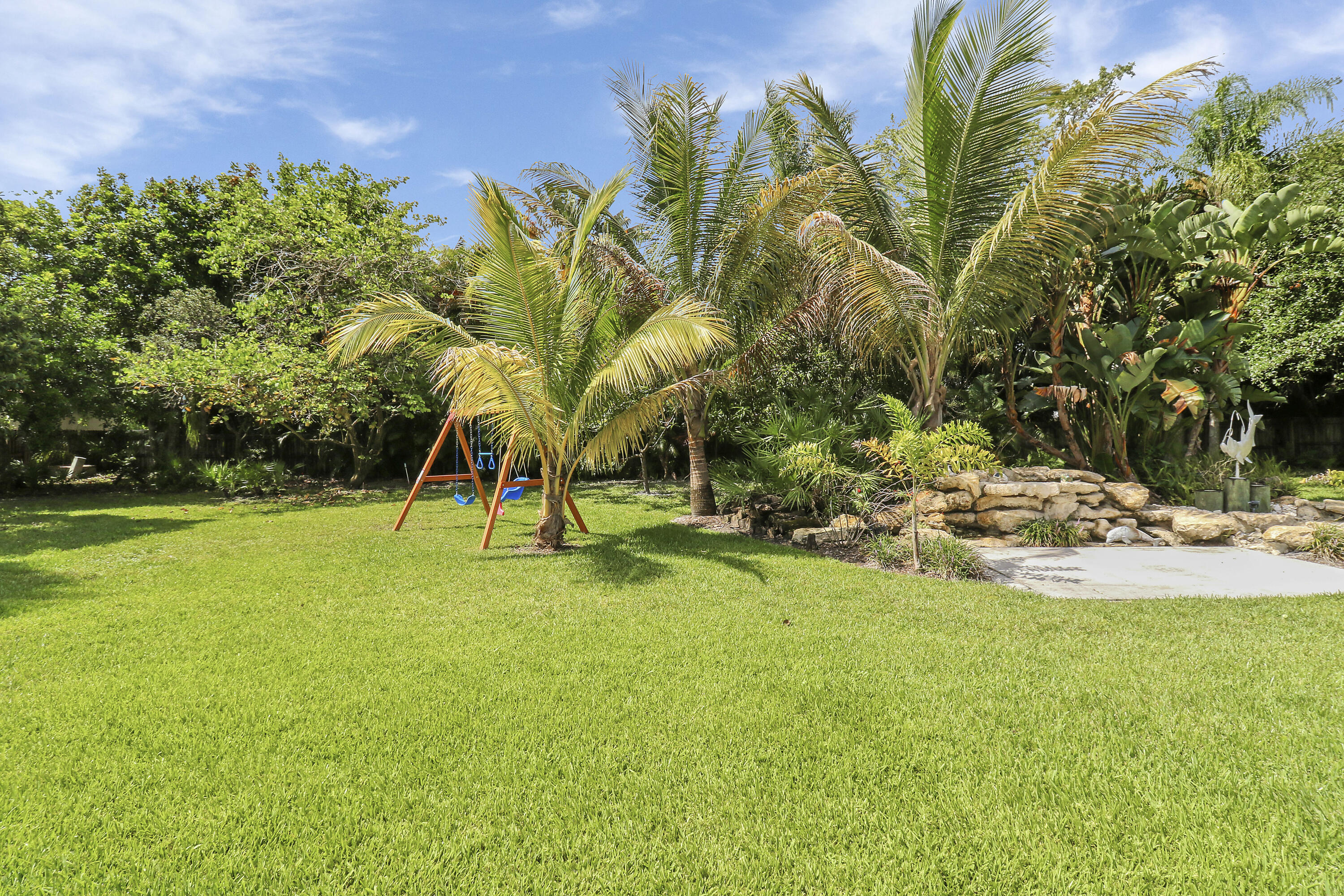 6372 North 197th Place Jupiter, FL 33458 - Photo 37 of 77 a view of a yard with a slide
