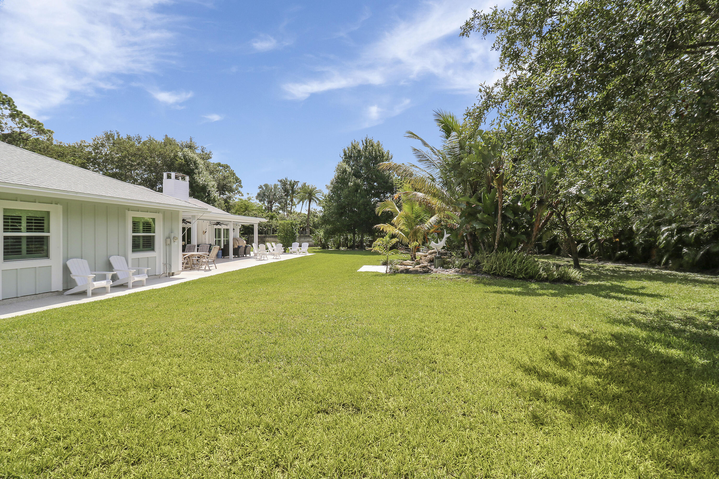 6372 North 197th Place Jupiter, FL 33458 - Photo 38 of 77 a view of a house with backyard and sitting area