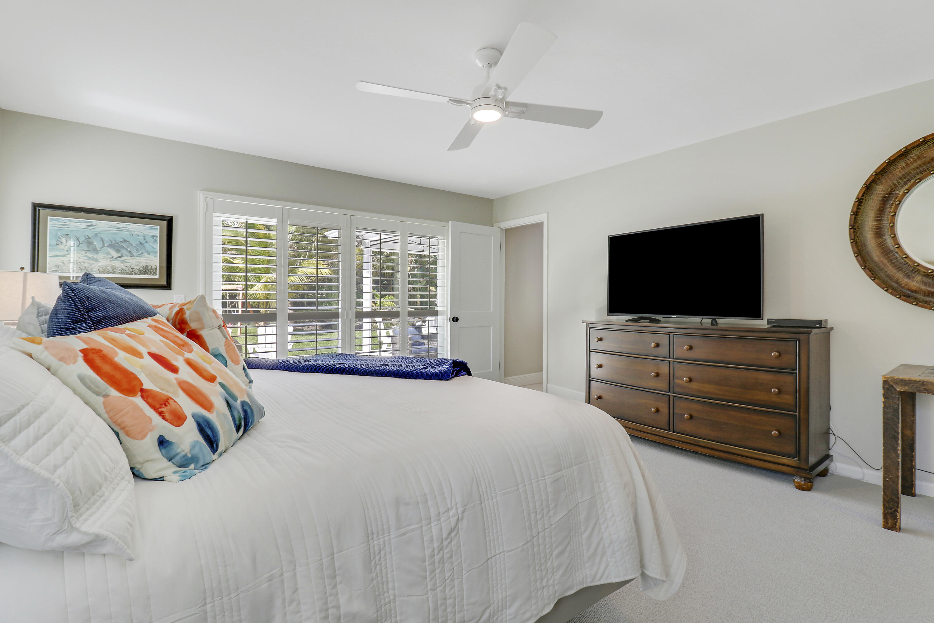 6372 North 197th Place Jupiter, FL 33458 - Photo 48 of 77 a bedroom with a bed and a flat screen tv