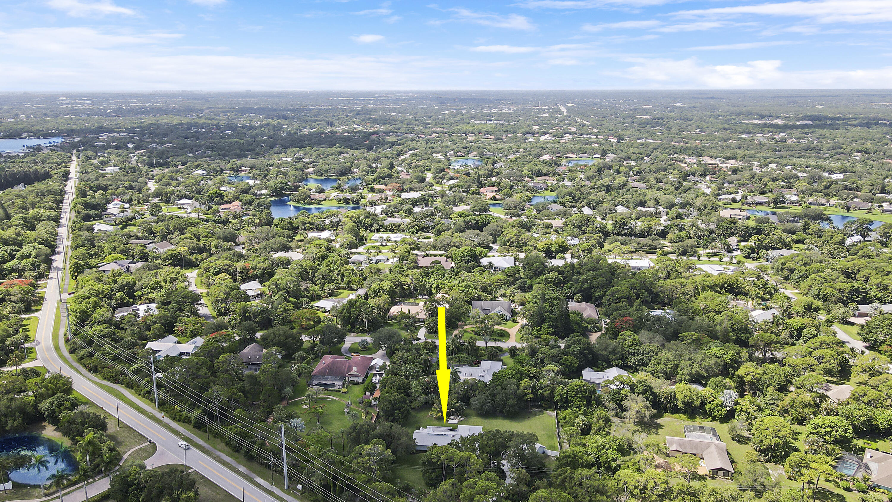 6372 North 197th Place Jupiter, FL 33458 - Photo 53 of 77 an aerial view of residential houses with city view and mountain view in back