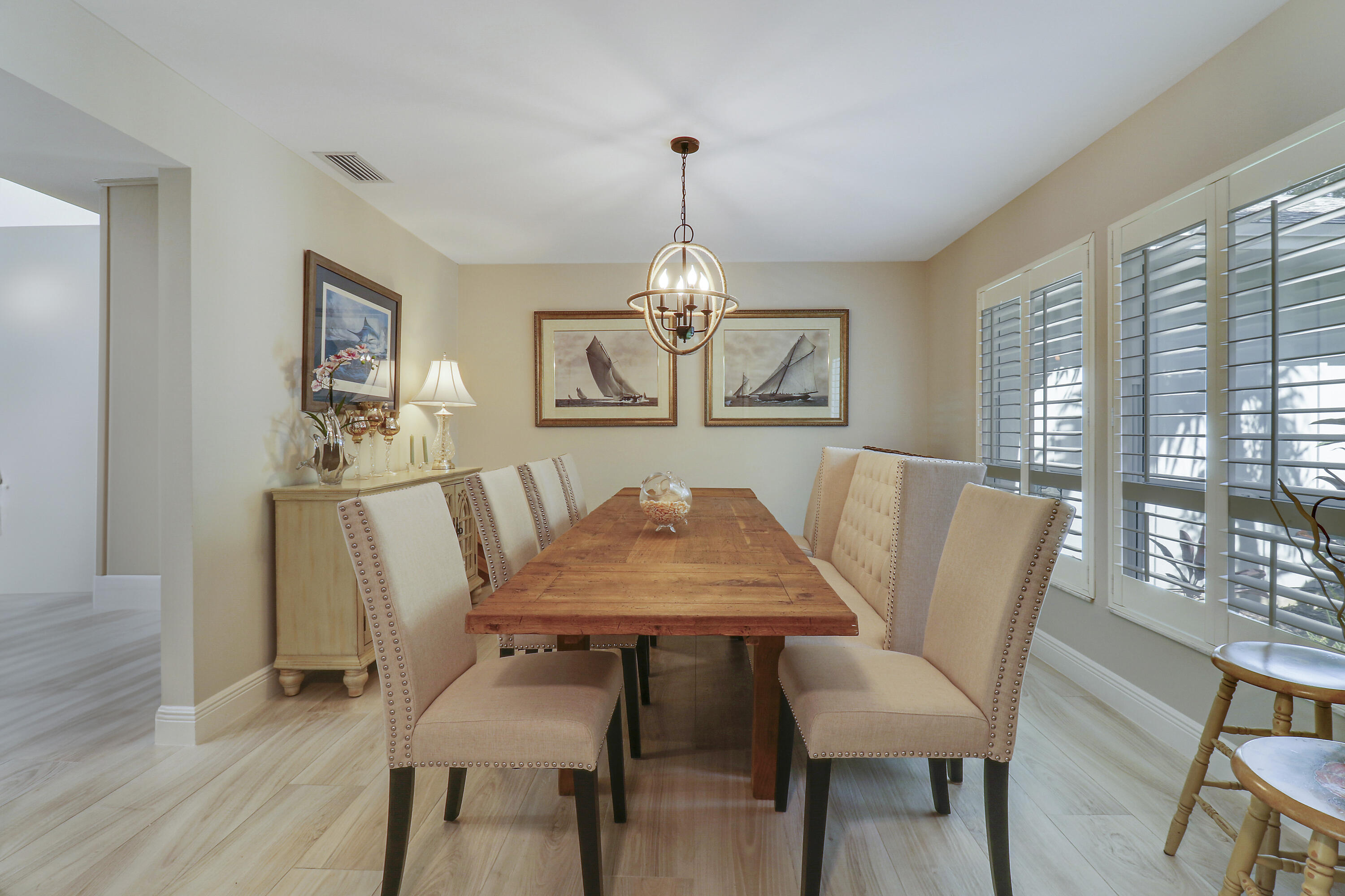 6372 North 197th Place Jupiter, FL 33458 - Photo 7 of 77 a view of a dining room with furniture window and wooden floor