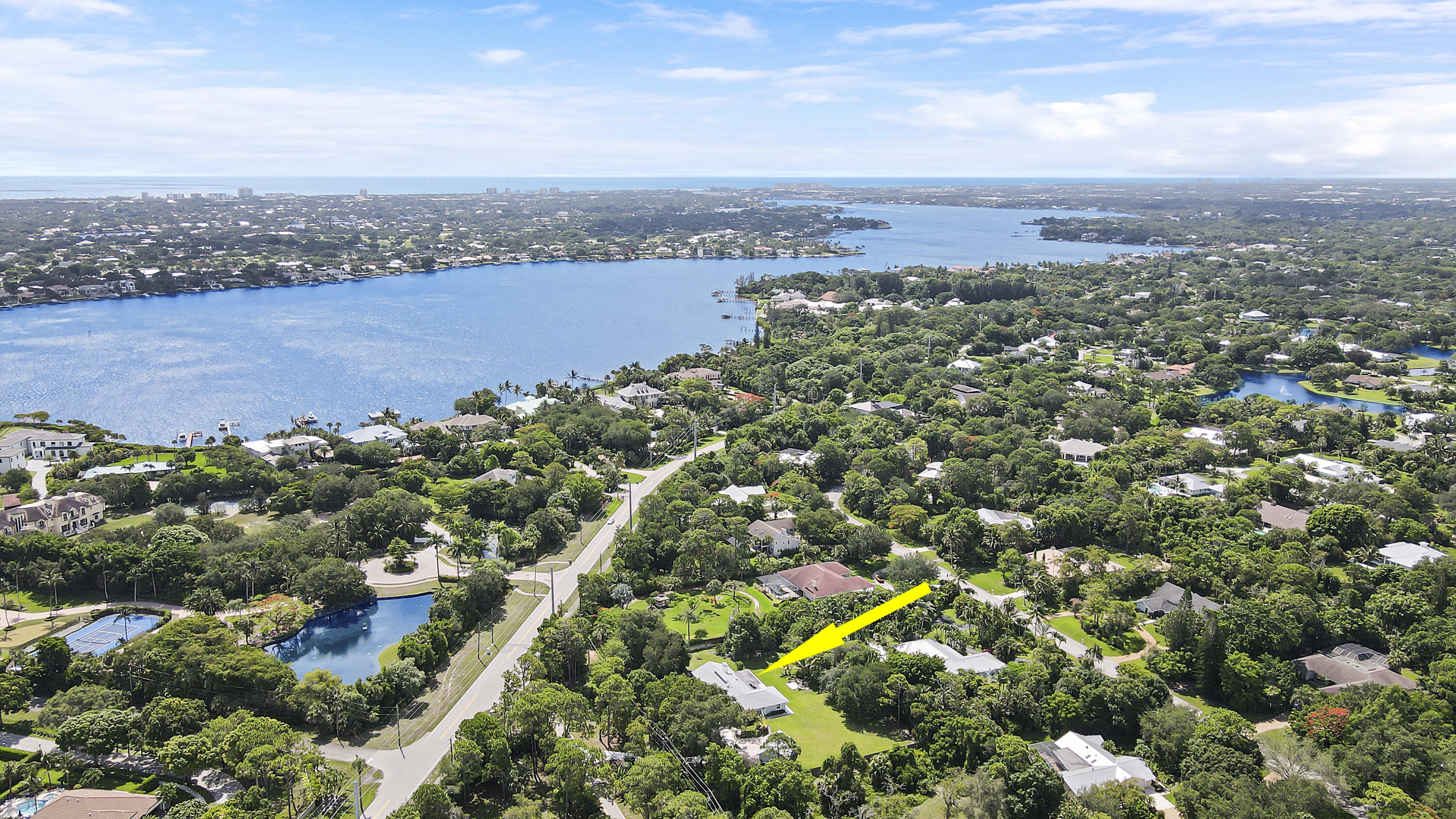 6372 North 197th Place Jupiter, FL 33458 - Photo 73 of 77 an aerial view of a houses with a yard and lake view