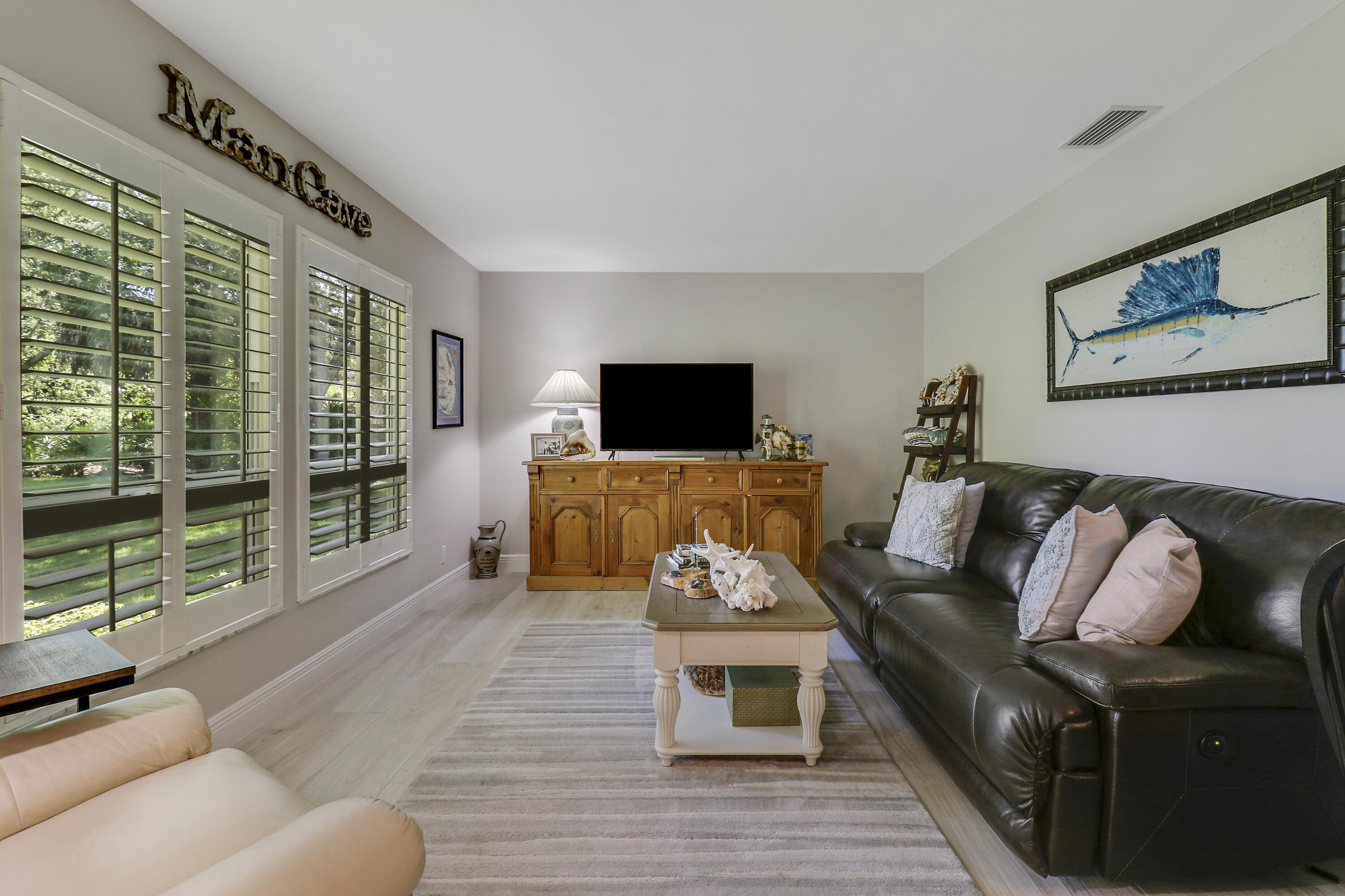 6372 North 197th Place Jupiter, FL 33458 - Photo 9 of 77 a living room with furniture fireplace and flat screen tv