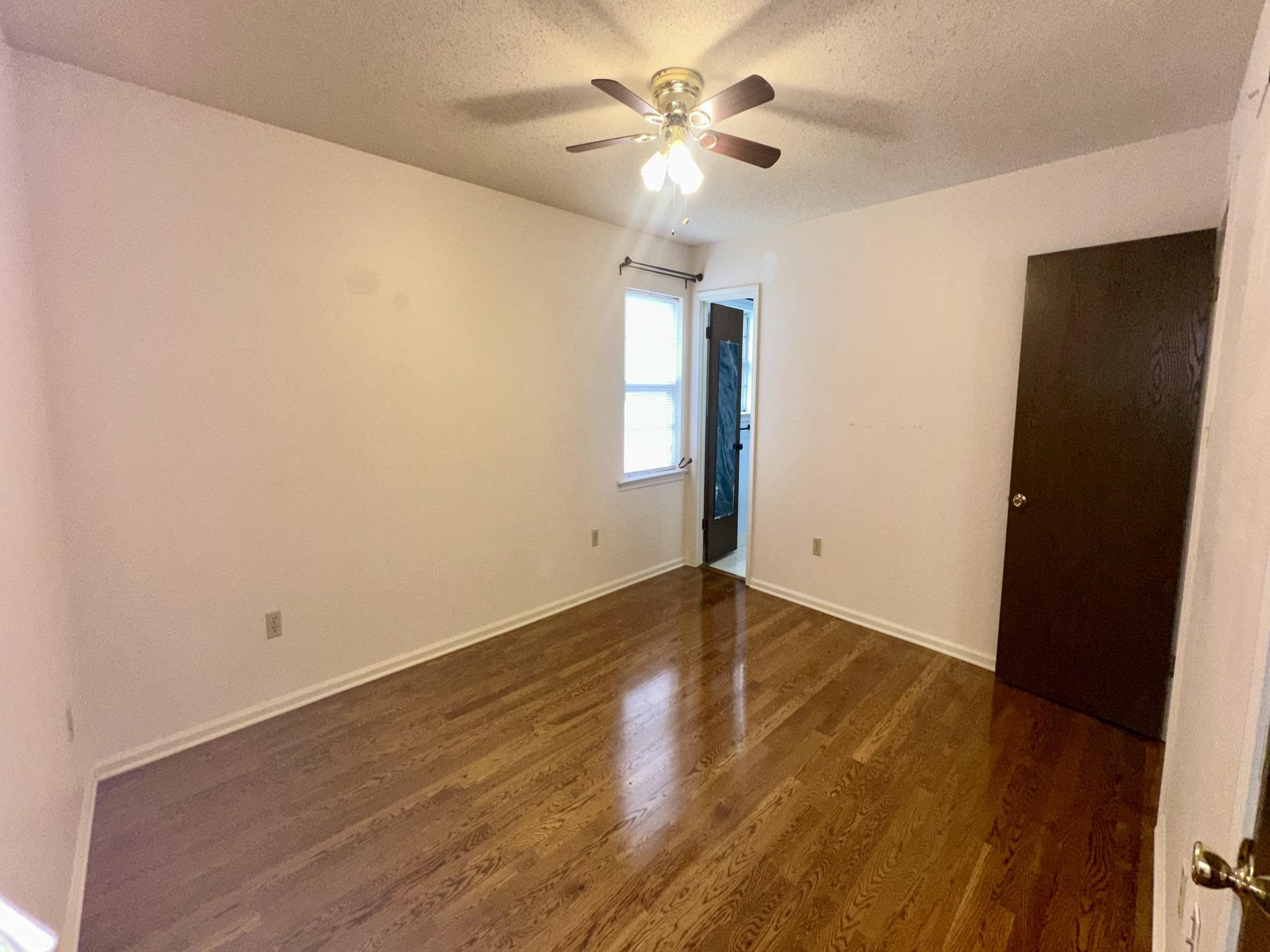 3250 Altruria Road Bartlett, TN 38134 - Photo 13 of 31 an empty room with wooden floor and window
