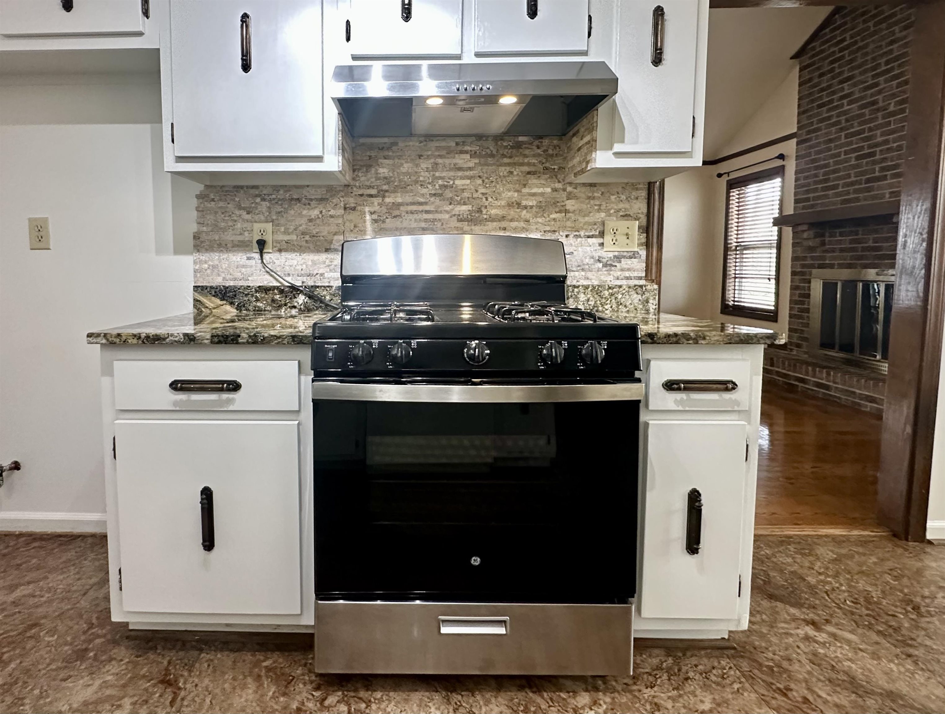 3250 Altruria Road Bartlett, TN 38134 - Photo 17 of 31 a white stove top oven sitting inside of a kitchen
