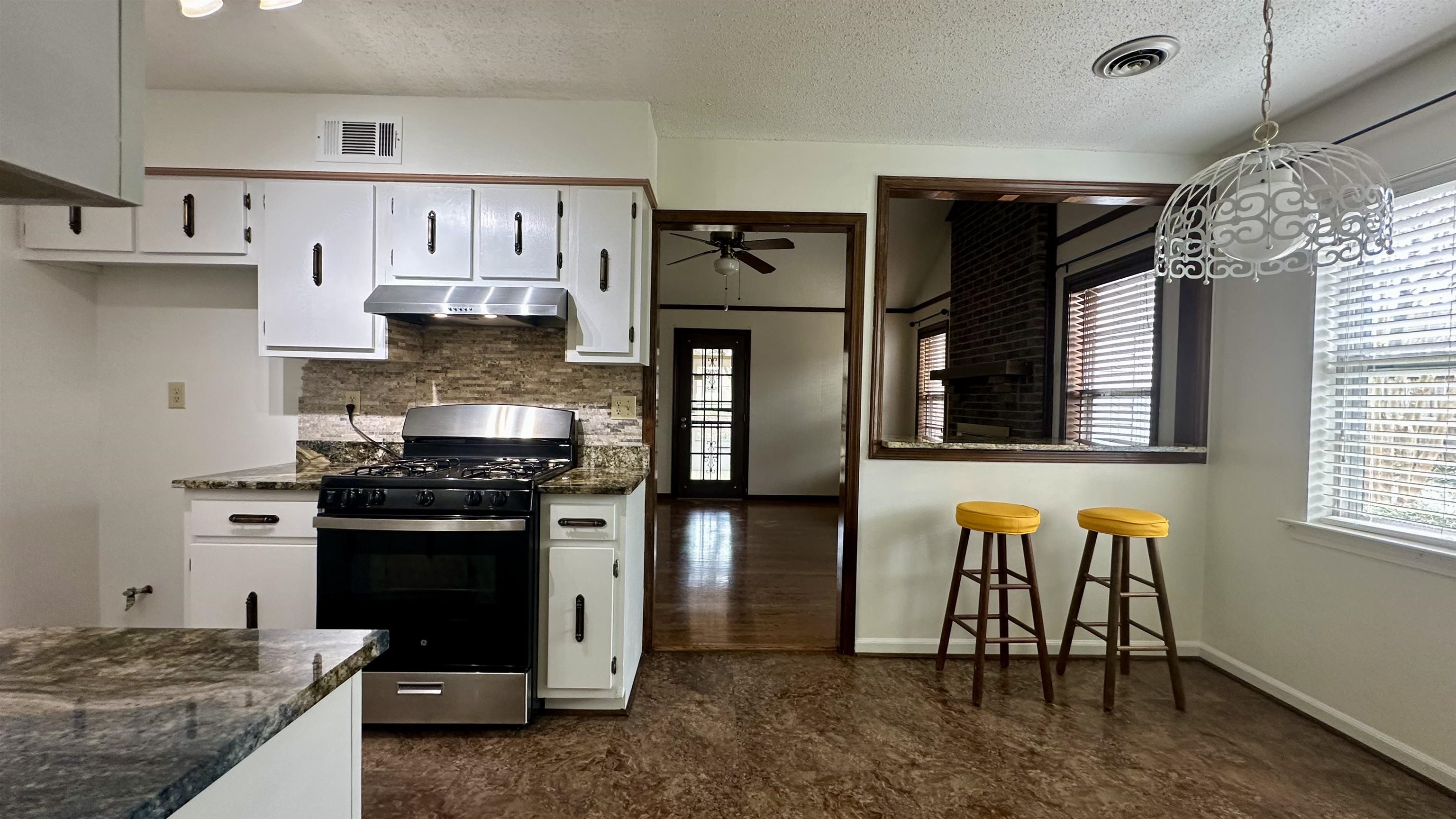 3250 Altruria Road Bartlett, TN 38134 - Photo 20 of 31 a kitchen with stainless steel appliances granite countertop a stove refrigerator and cabinets
