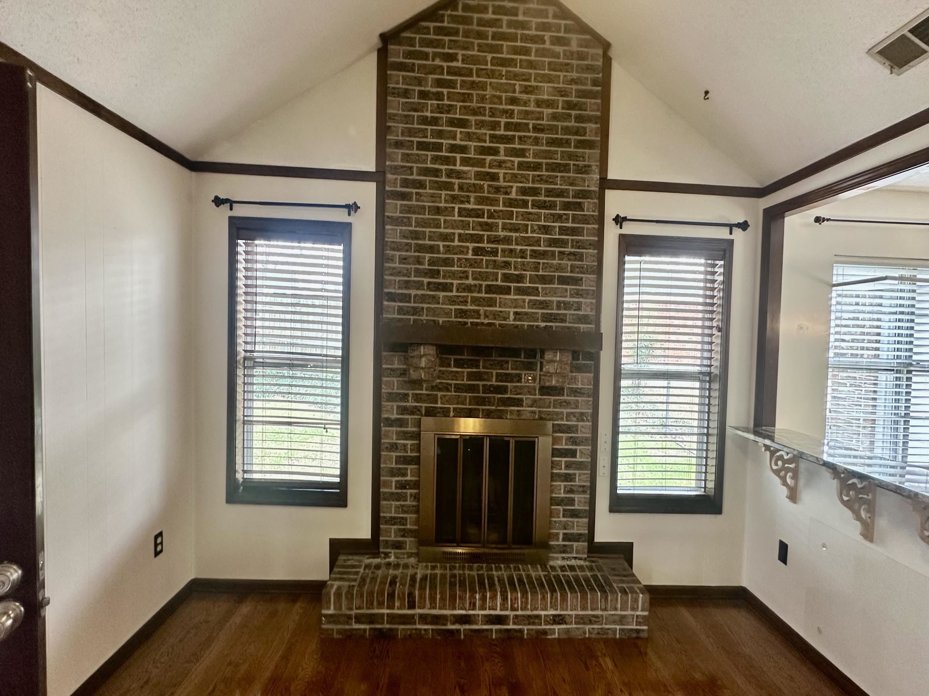 3250 Altruria Road Bartlett, TN 38134 - Photo 8 of 31 a living room with furniture and a fireplace