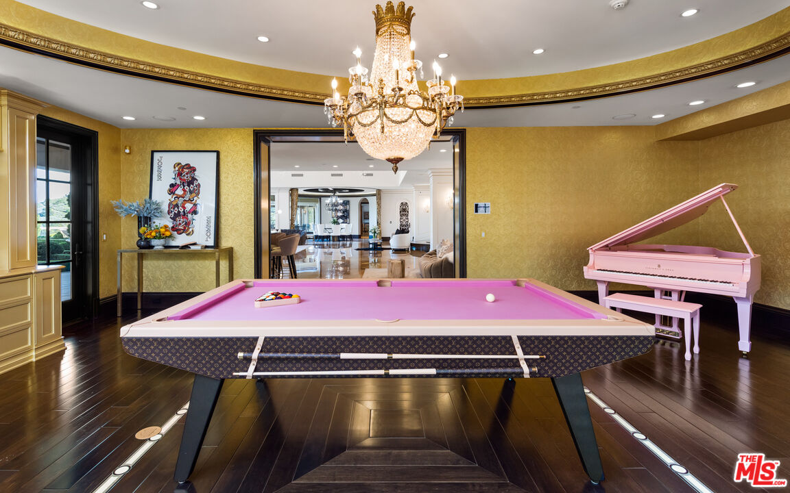 25220 Walker Road Hidden Hills, CA 91302 - Photo 21 of 29 a room with furniture and chandelier