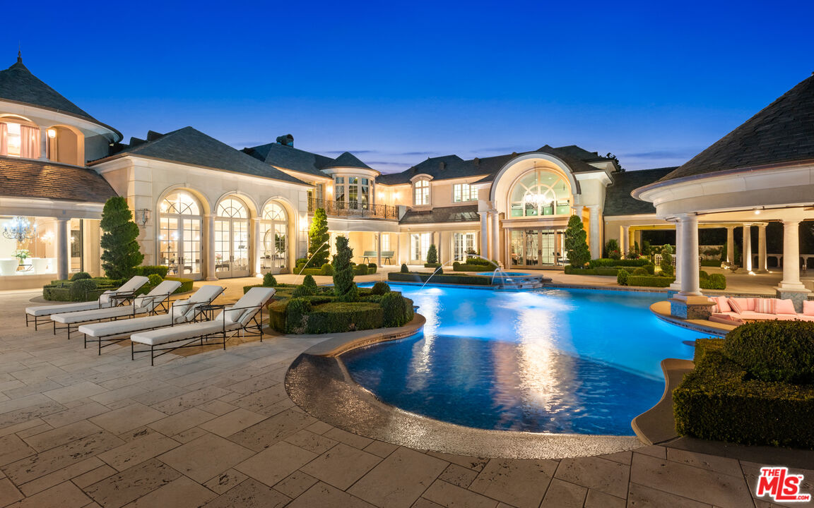 25220 Walker Road Hidden Hills, CA 91302 - Photo 25 of 29 a view of a swimming pool with outdoor seating