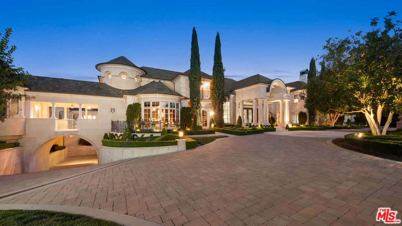 25220 Walker Road Hidden Hills, CA 91302 - Photo 27 of 29 a view of a house with a yard