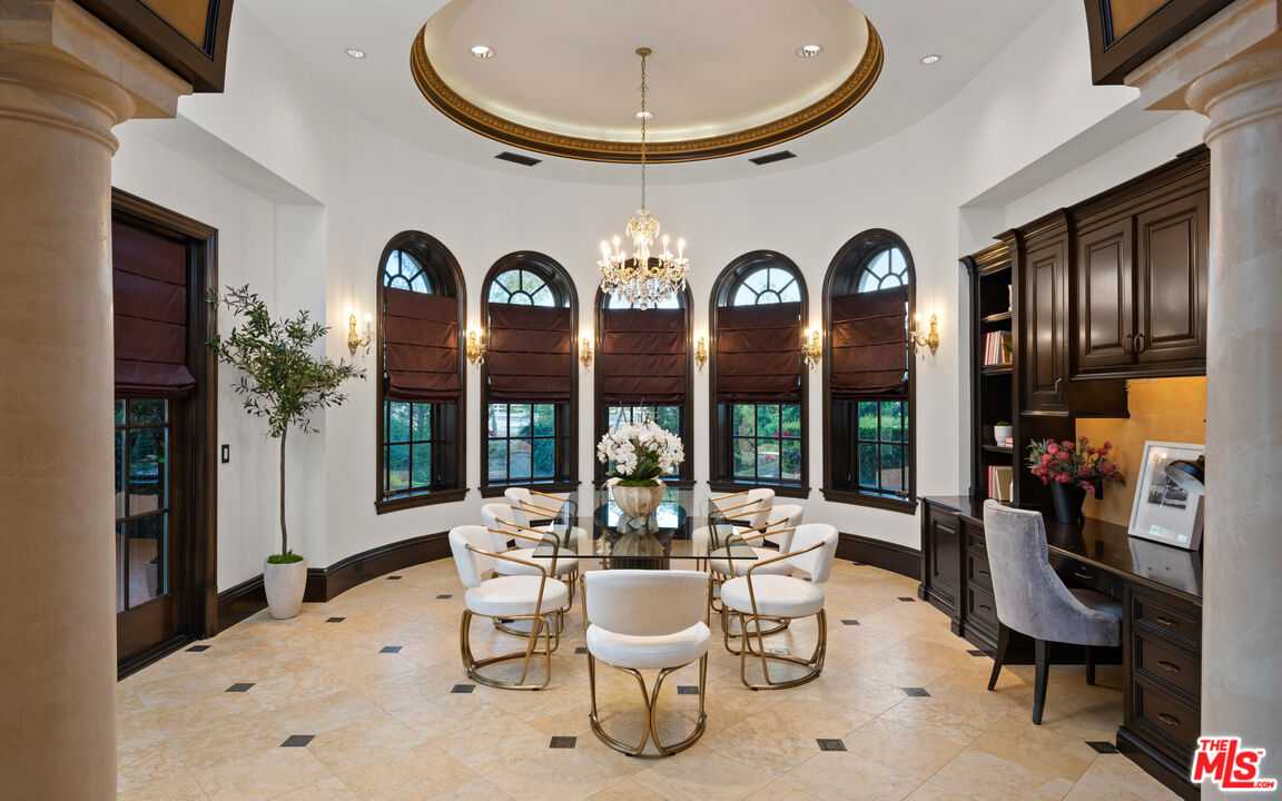 25220 Walker Road Hidden Hills, CA 91302 - Photo 10 of 29 a very nice looking dining room with kitchen view and a large window