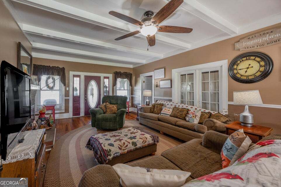 69 Myers Avenue Trion, GA 30753 - Photo 12 of 51 a living room with furniture a clock and a ceiling fan