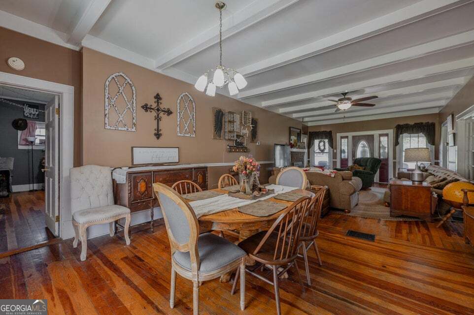 69 Myers Avenue Trion, GA 30753 - Photo 13 of 51 a view of a dining room with furniture a chandelier and wooden floor