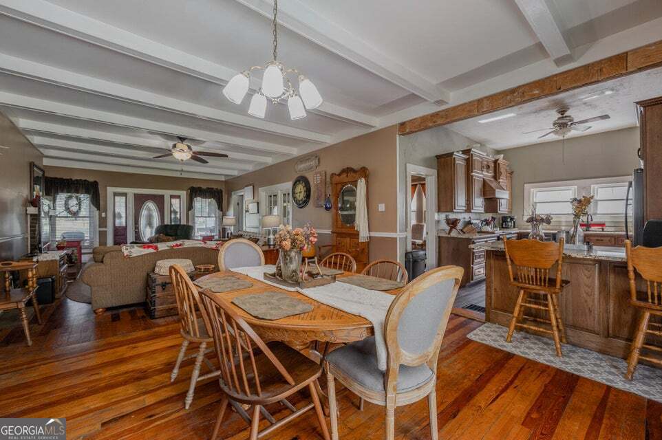 69 Myers Avenue Trion, GA 30753 - Photo 14 of 51 a view of a dining room with furniture a chandelier and wooden floor
