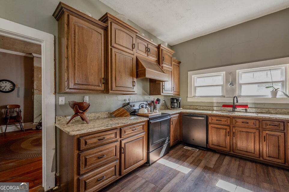 69 Myers Avenue Trion, GA 30753 - Photo 18 of 51 a kitchen with stainless steel appliances granite countertop a sink stove and cabinets