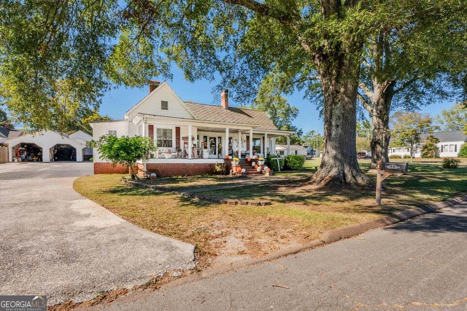 69 Myers Avenue Trion, GA 30753 - Photo 2 of 51 a view of a house with swimming pool and a yard