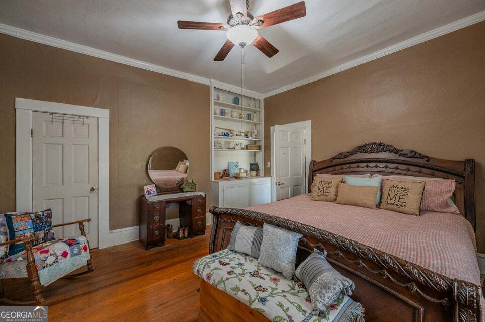 69 Myers Avenue Trion, GA 30753 - Photo 22 of 51 a bedroom with a bed and wooden floor