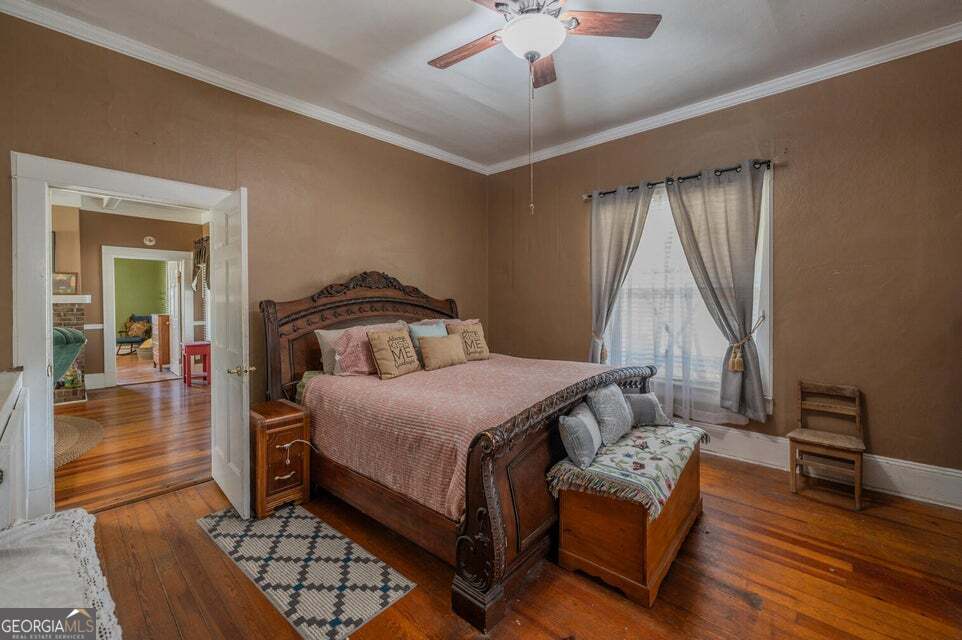 69 Myers Avenue Trion, GA 30753 - Photo 23 of 51 a bedroom with a bed and wooden floor