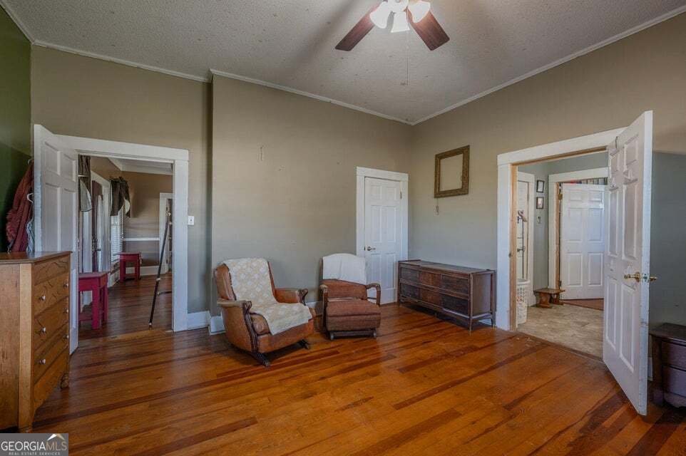 69 Myers Avenue Trion, GA 30753 - Photo 26 of 51 a bedroom with furniture and a wooden floor