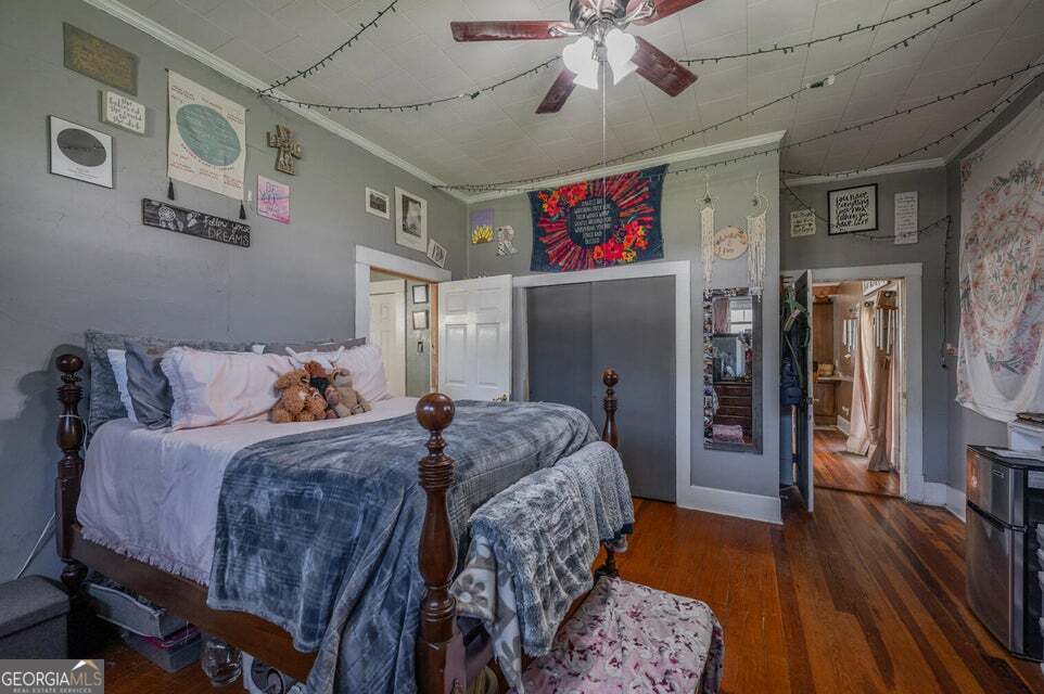 69 Myers Avenue Trion, GA 30753 - Photo 28 of 51 a bedroom with a bed and a chandelier