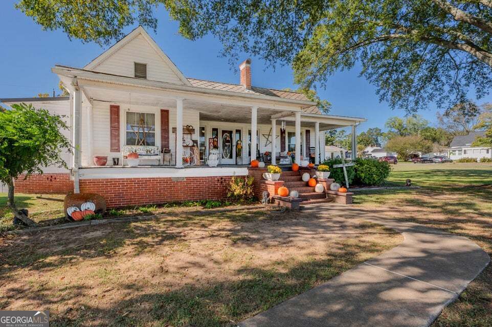 69 Myers Avenue Trion, GA 30753 - Photo 3 of 51 front view of a house with a patio