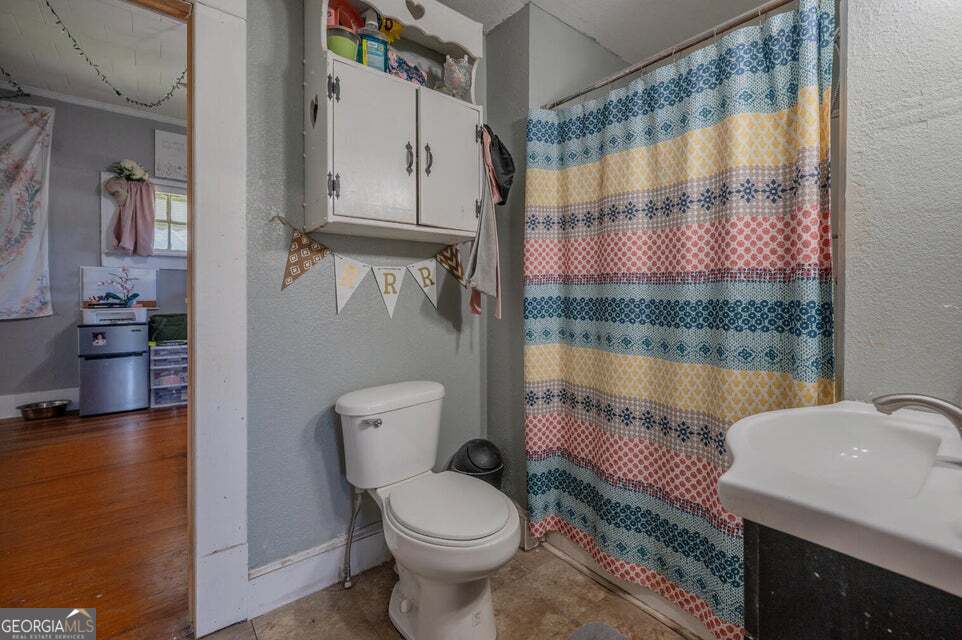 69 Myers Avenue Trion, GA 30753 - Photo 33 of 51 a bathroom with a toilet a sink and a shower