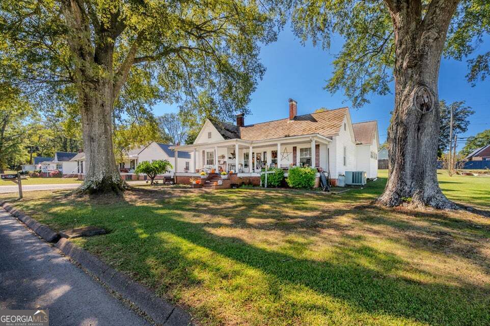 69 Myers Avenue Trion, GA 30753 - Photo 42 of 51 a view of a house with garden and basketball area