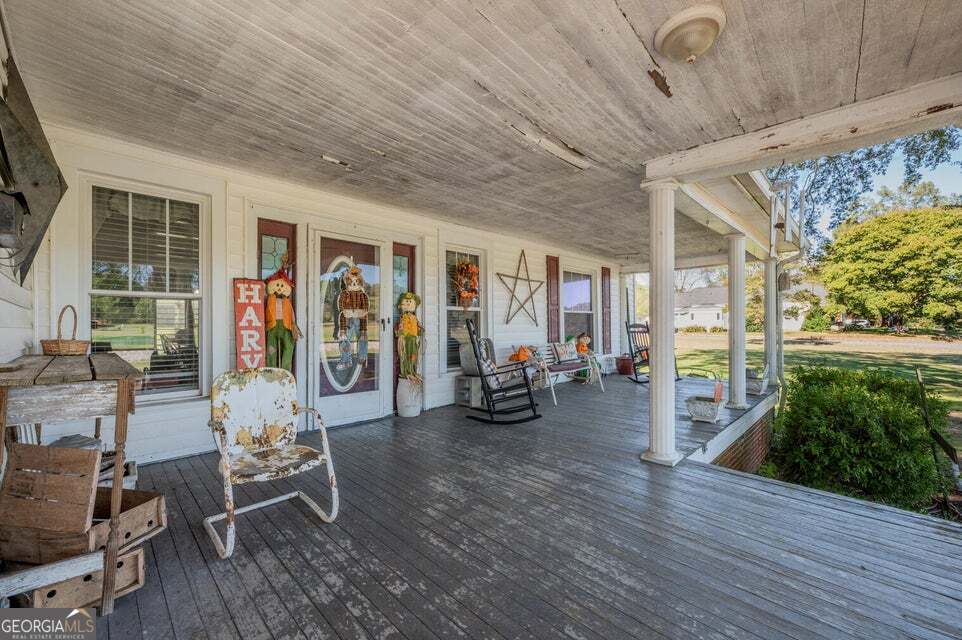 69 Myers Avenue Trion, GA 30753 - Photo 5 of 51 a view of a livingroom with hardwood floor and a ceiling fan