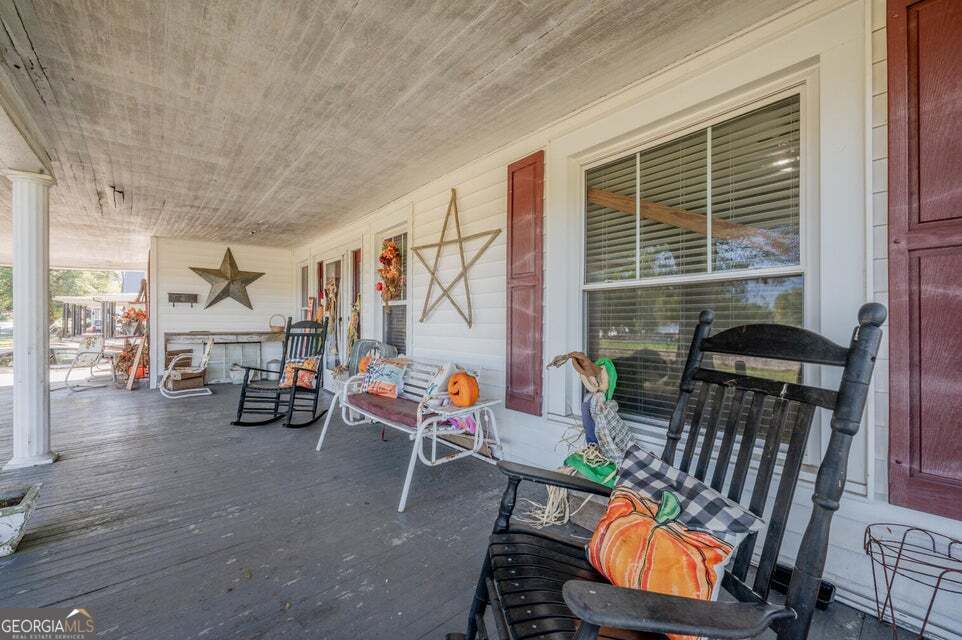 69 Myers Avenue Trion, GA 30753 - Photo 6 of 51 an outdoor living area with chairs and a table