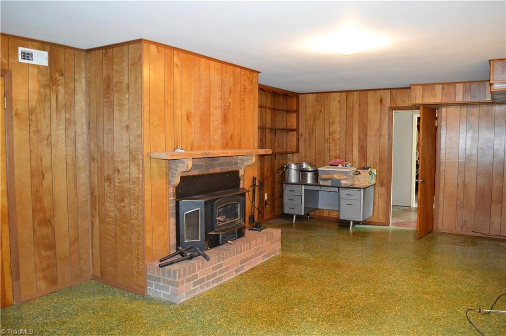 260 Lake Leonard Road Lexington, NC 27295 - Photo 22 of 29 Heated room in basement with fireplace.