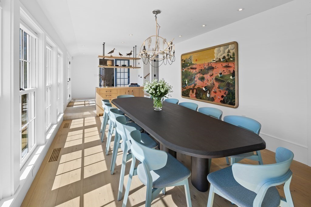 178 Queen Anne Road Chatham, MA 02633 - Photo 16 of 33 a view of a dining room with furniture and a chandelier