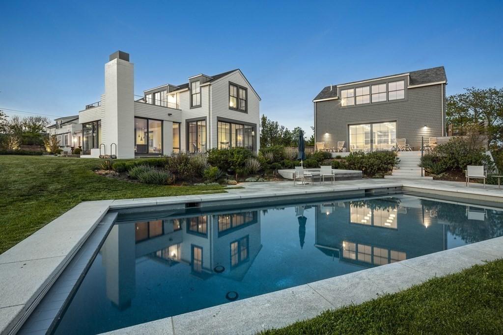 178 Queen Anne Road Chatham, MA 02633 - Photo 2 of 33 a front view of a house with a yard