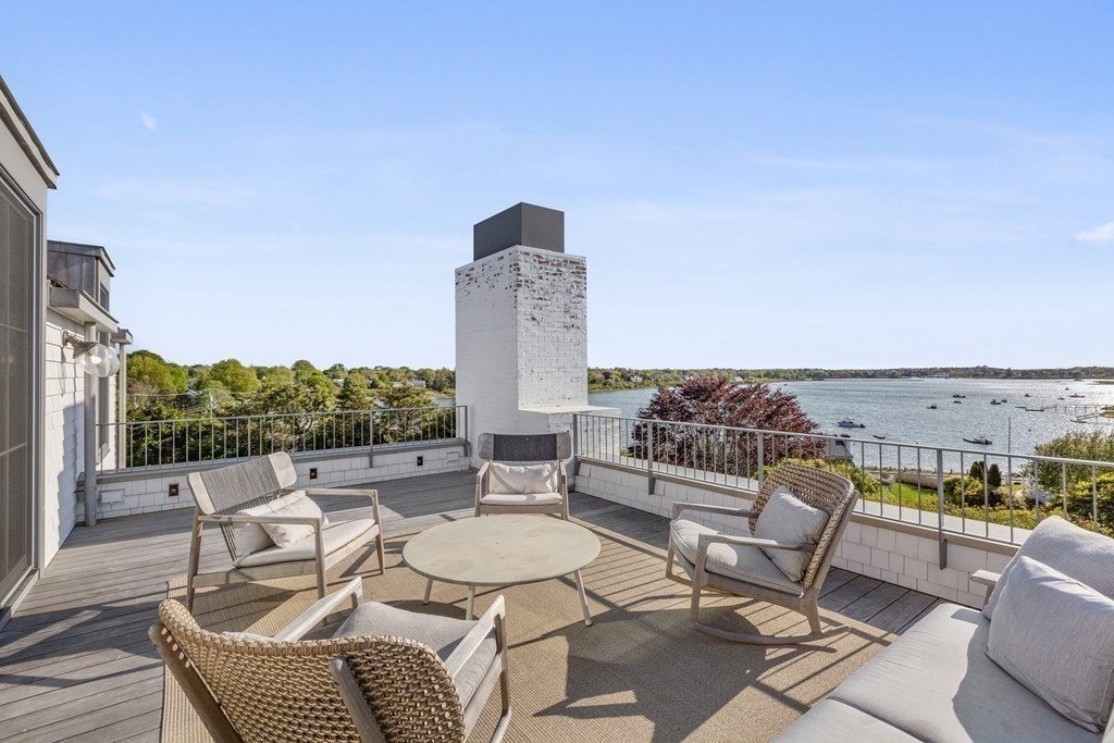 178 Queen Anne Road Chatham, MA 02633 - Photo 25 of 33 a roof deck with couches and potted plants with sky view