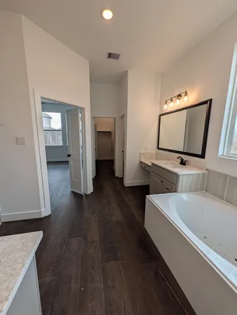 a view of residential houses with outdoor space and lake view