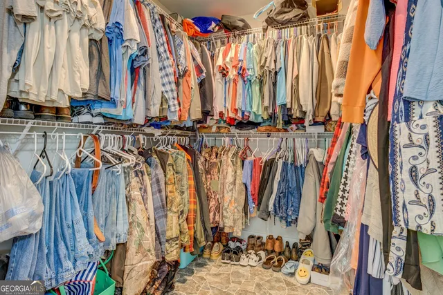 a bedroom with a bed and a cabinets