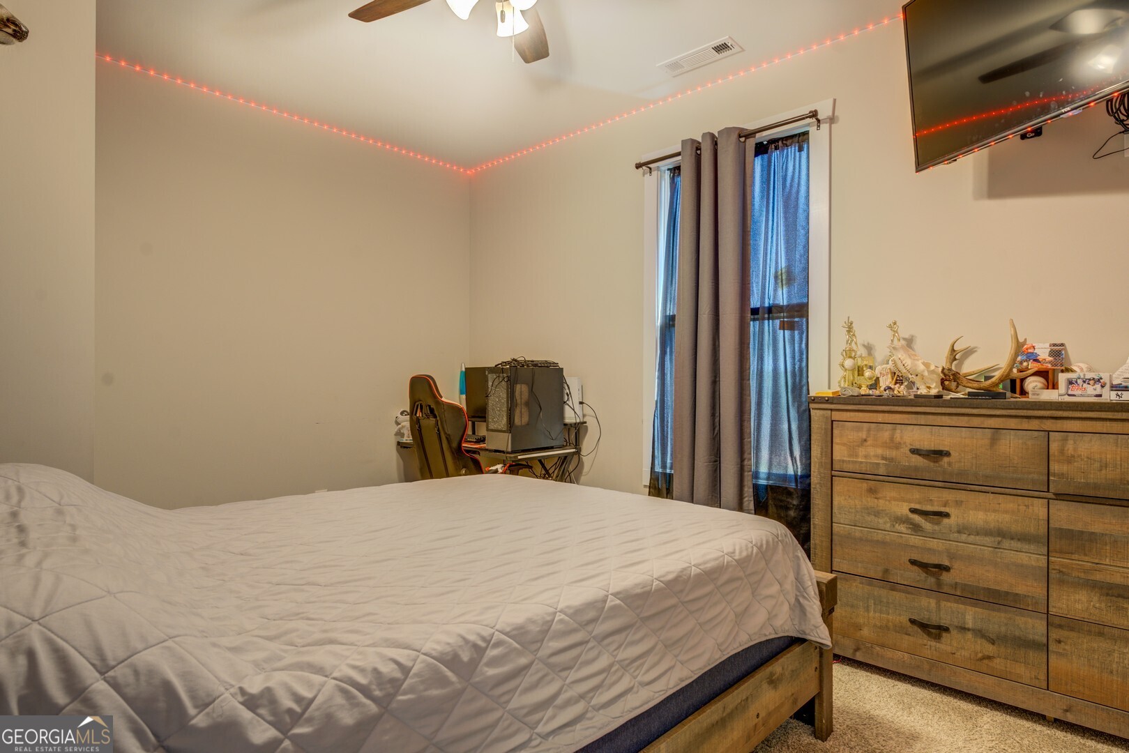 4348 Marshall Stewart Road Crawfordville, GA 30631 - Photo 33 of 80 a bedroom with a bed and a cabinets