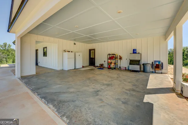 a view of a livingroom with furniture and a window