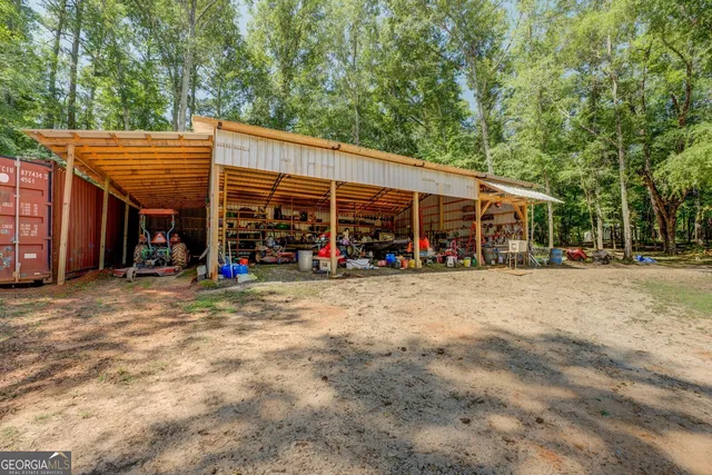 a view of a wooden house with a yard