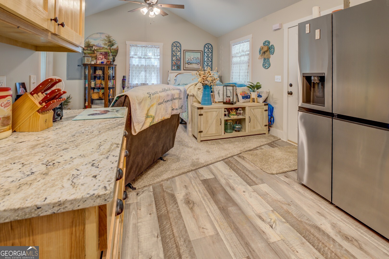 4348 Marshall Stewart Road Crawfordville, GA 30631 - Photo 59 of 80 a kitchen with stainless steel appliances kitchen island granite countertop a refrigerator and a stove
