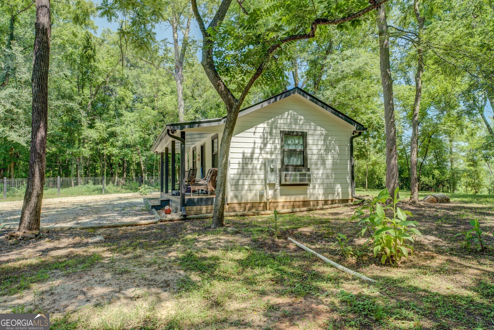 4348 Marshall Stewart Road Crawfordville, GA 30631 - Photo 63 of 80 a view of a house with backyard and trees