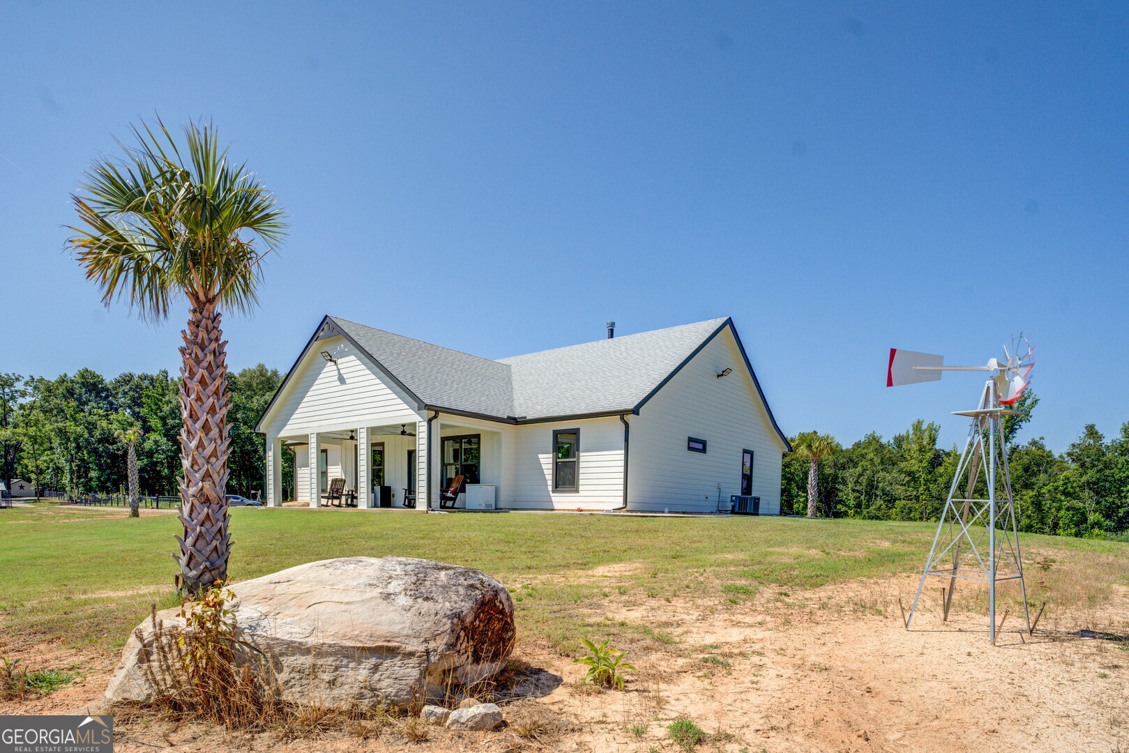 4348 Marshall Stewart Road Crawfordville, GA 30631 - Photo 7 of 80 a front view of a house with garden