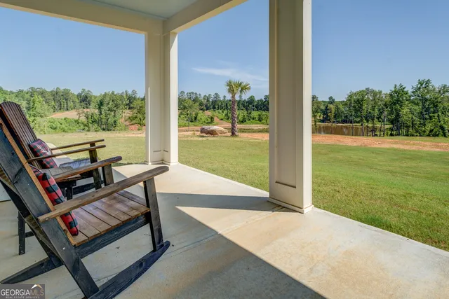 a view of a outdoor space with furniture and garden