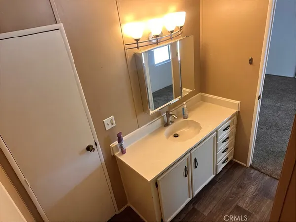 a bathroom with a double vanity sink and mirror