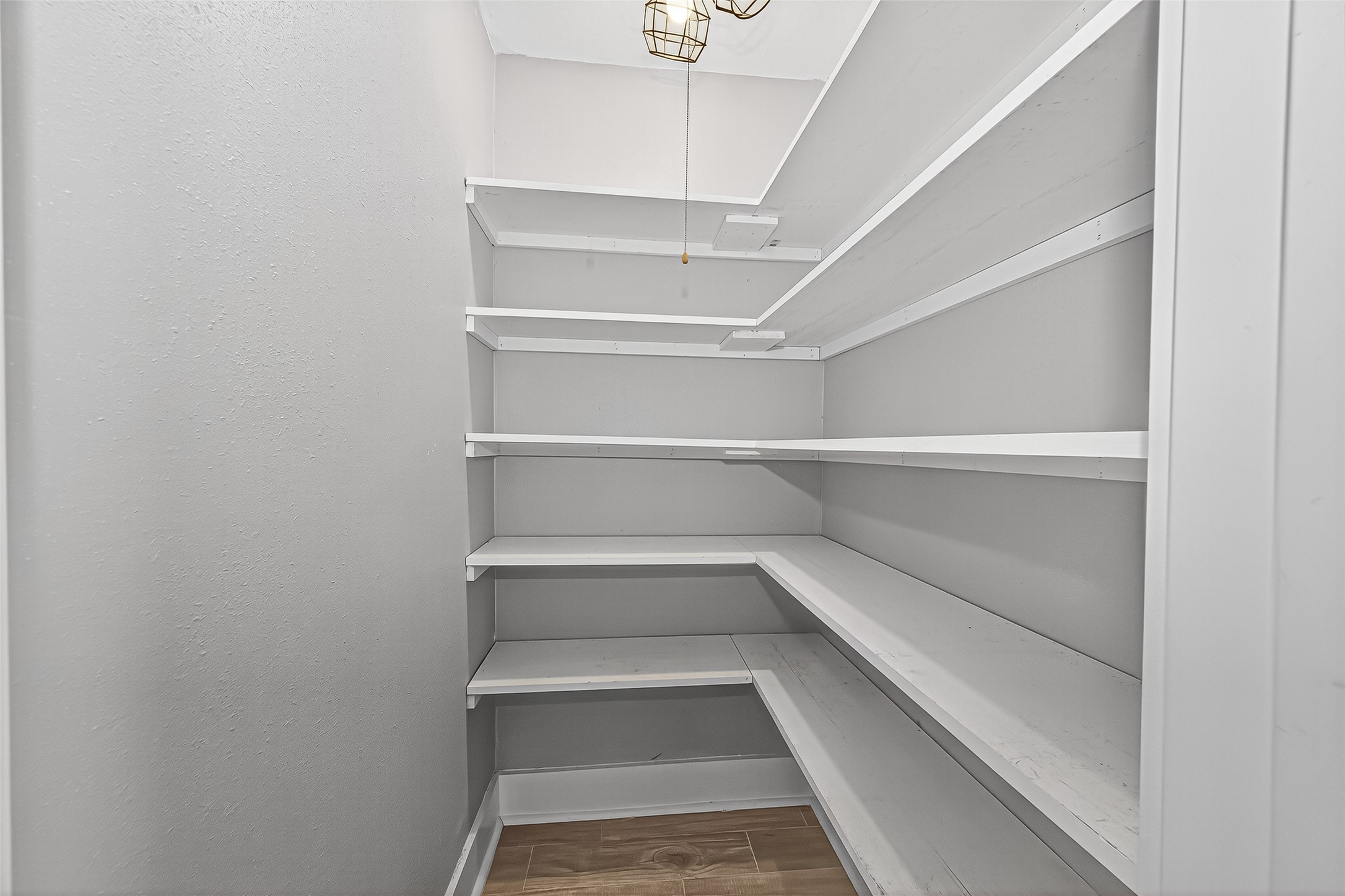 830 Threadneedle Street, Unit 240 Houston, TX 77079 - Photo 14 of 31 a view of store room with empty racks